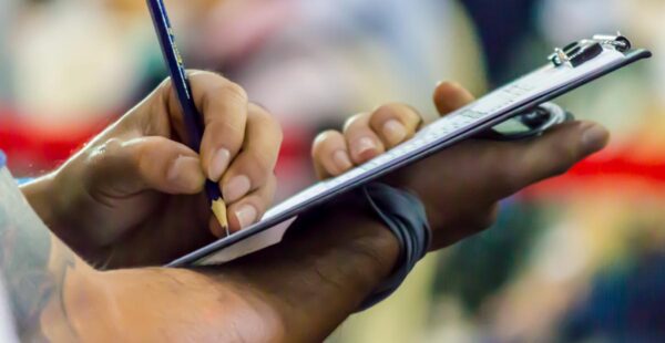Event Management Image of someone holding clipboard