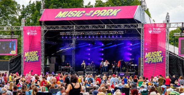 Music in the Park stage with branding