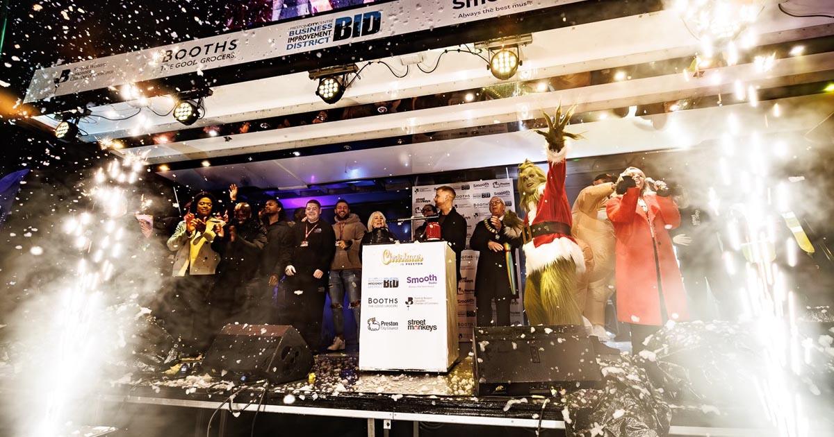 People on stage with fireworks at Preston Christmas Lights Switch on 2024